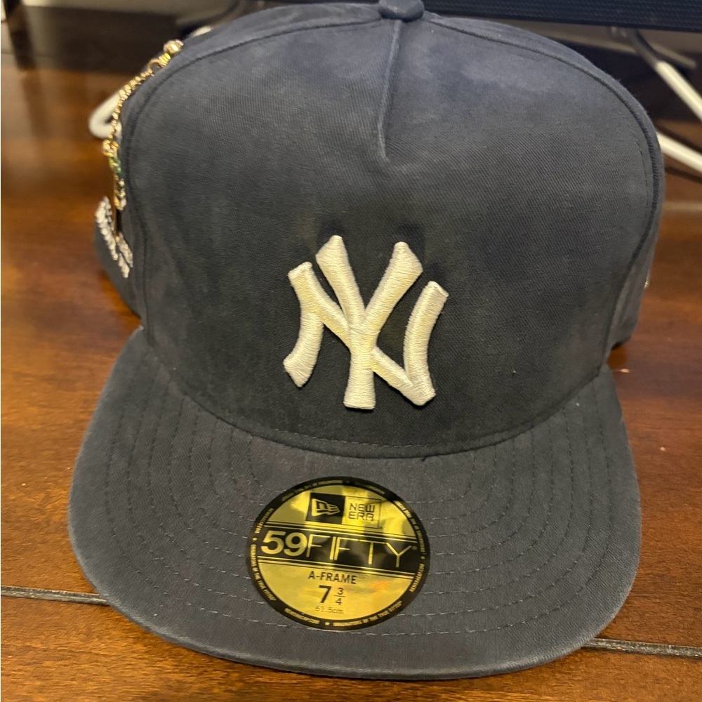 New Era Black Cap with White and Blue Embroidery